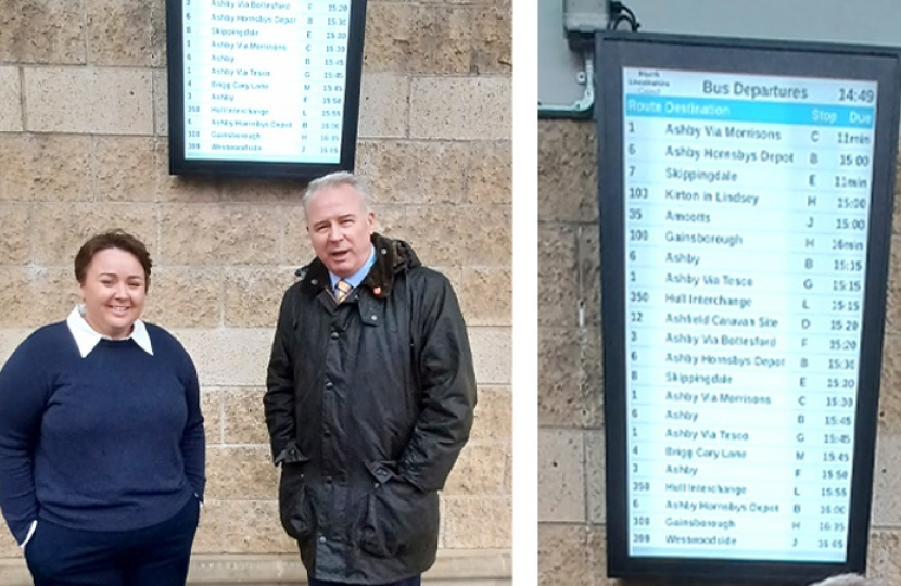 Holly Mumby-Croft MP unveiling the digital new bus timetable screens