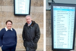 Holly Mumby-Croft MP unveiling the digital new bus timetable screens