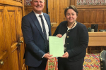 Holly Mumby-Croft MP and the Sports Minister with the Football Governance Bill
